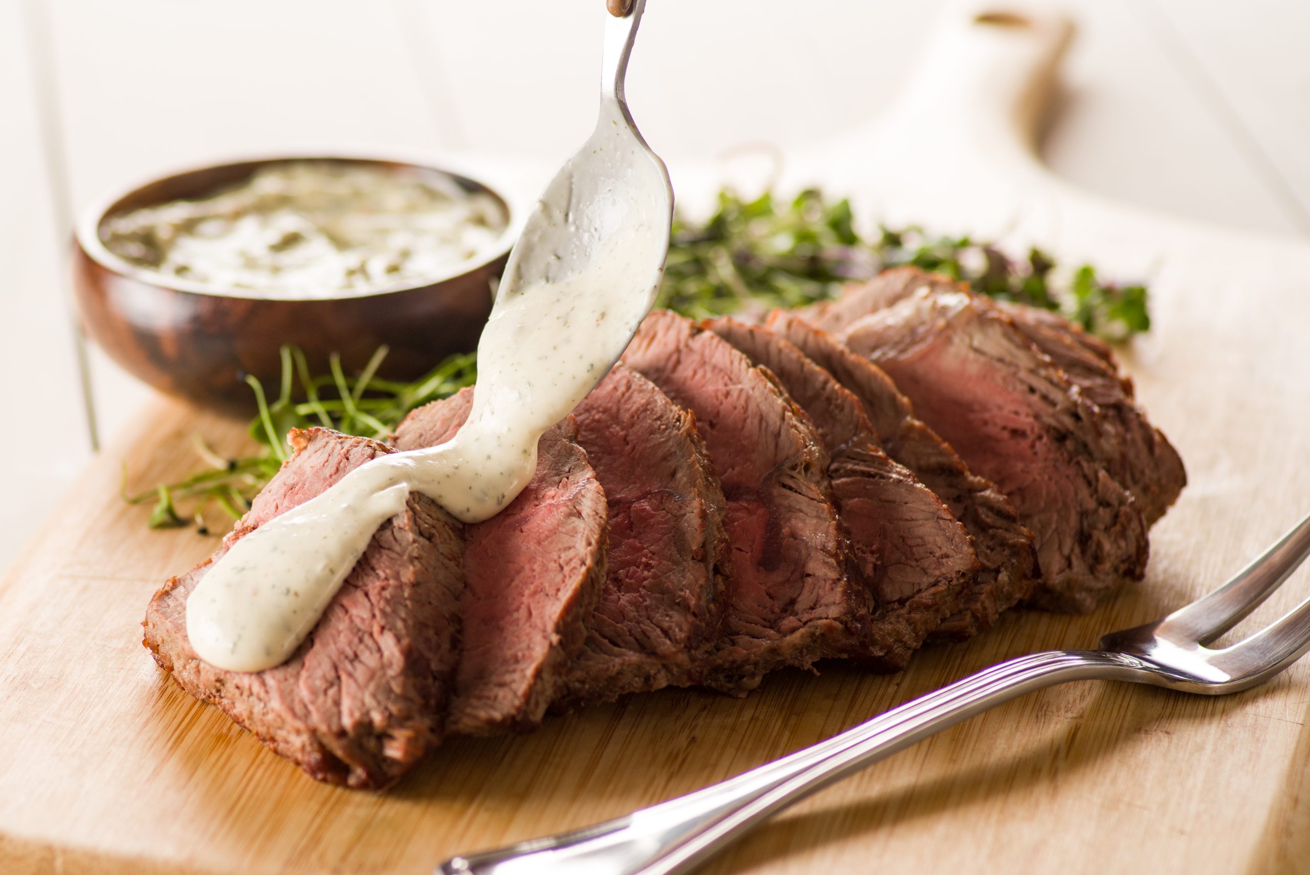 Learn to make roasted top sirloin with chimichurri aioli