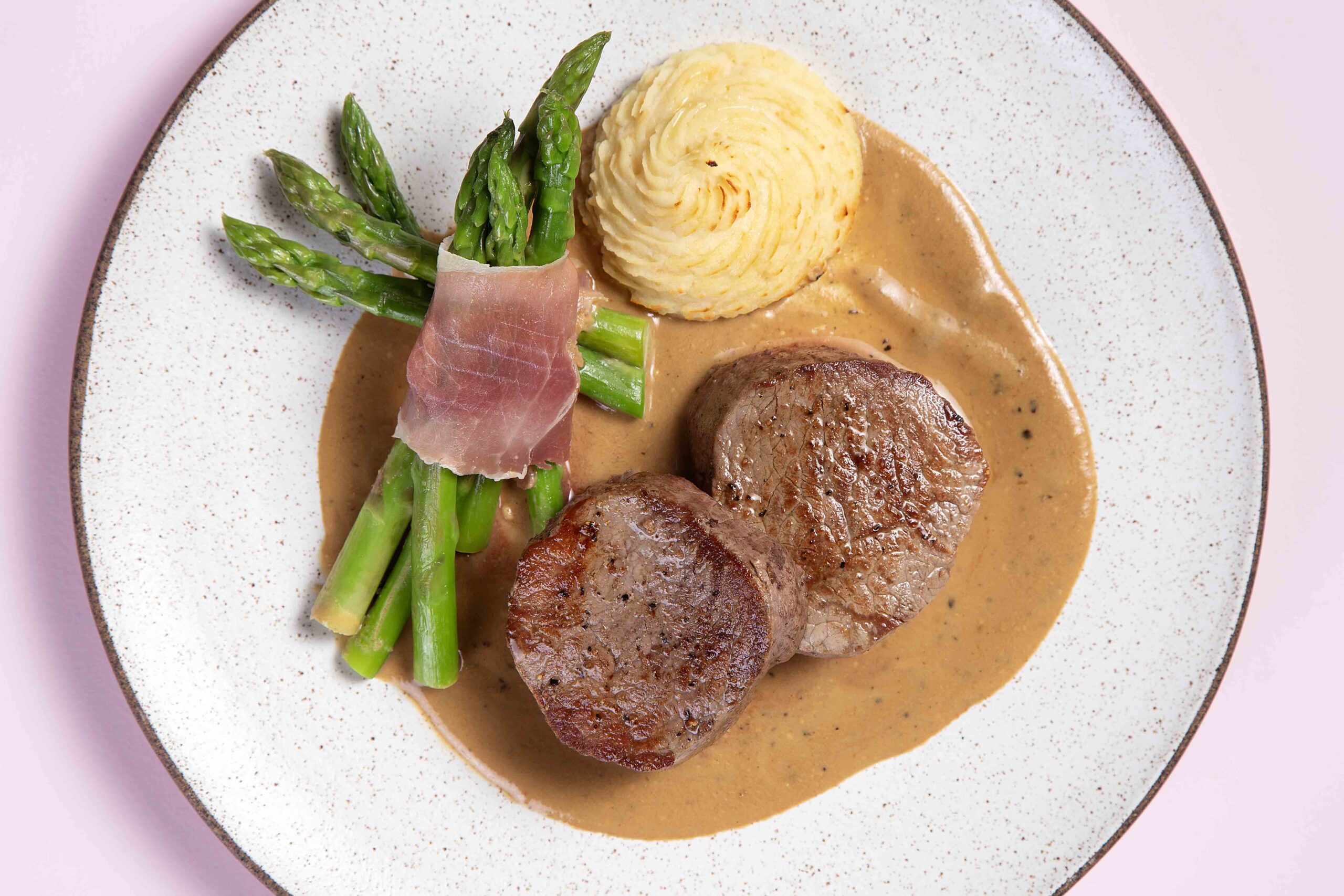 Tenderloin medallions au poivre with duchess potatoes